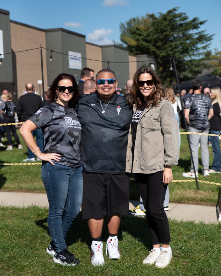 Mission 22 event participants posing together during a veteran support fundraiser.