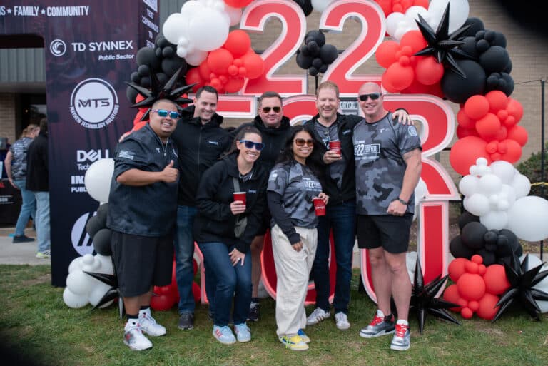 Colossal team members posing together during the Mission 22 community fundraiser.