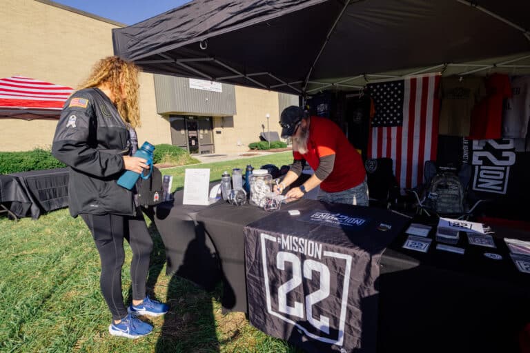 Mission 22 event booth supporting veteran mental health and community outreach programs.